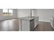 Kitchen island featuring stainless steel dishwasher, gray countertop, and a sink at 633 Bridgeman Rd, Avon, IN 46123