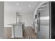Kitchen with stainless steel refrigerator, white cabinets and island with gray countertop at 633 Bridgeman Rd, Avon, IN 46123