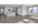 Open-concept living room and kitchen featuring white cabinets and stainless steel appliances at 633 Bridgeman Rd, Avon, IN 46123