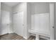 Bright mudroom features a bench with storage, closet, and stylish gray-toned wood flooring at 633 Bridgeman Rd, Avon, IN 46123