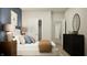 Inviting bedroom with an accent wall, stylish decor, and neutral color scheme at 647 Bridgeman Rd, Avon, IN 46123