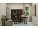 A stylish home office with a wooden bookcase and neutral tones throughout at 647 Bridgeman Rd, Avon, IN 46123