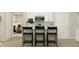 Modern kitchen with white cabinets, stainless steel appliances, and a breakfast bar at 647 Bridgeman Rd, Avon, IN 46123