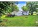 Spacious backyard showcasing lush greenery and ample space for outdoor activities at 6580 N Us Highway 31, Whiteland, IN 46184