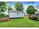 Green backyard with a small white shed, picnic table, and trailer at 6580 N Us Highway 31, Whiteland, IN 46184