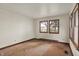 Bedroom with hardwood floors, natural light, and baseboard heat at 6580 N Us Highway 31, Whiteland, IN 46184