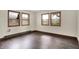 Bedroom with dark floors and multiple windows at 6580 N Us Highway 31, Whiteland, IN 46184