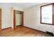 Bedroom featuring wooden floors, window, and closet at 6580 N Us Highway 31, Whiteland, IN 46184