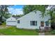 Exterior view of home featuring detached garage, and green lawn at 6580 N Us Highway 31, Whiteland, IN 46184