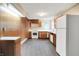 Well-lit kitchen with wooden cabinets, white appliances, and ample counter space at 6580 N Us Highway 31, Whiteland, IN 46184