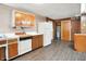 View of retro kitchen featuring wood cabinets and updated flooring at 6580 N Us Highway 31, Whiteland, IN 46184