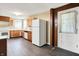 Functional kitchen with wood cabinets, laminate counters, and modern white appliances at 6580 N Us Highway 31, Whiteland, IN 46184