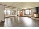 Inviting living space featuring wood floors, ample windows, and a cozy brick fireplace at 6580 N Us Highway 31, Whiteland, IN 46184