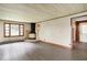 Open-concept living area with hardwood floors, fireplace, and natural light-filled windows at 6580 N Us Highway 31, Whiteland, IN 46184
