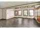 Spacious living room with wood floors and bright natural light coming through ample windows at 6580 N Us Highway 31, Whiteland, IN 46184