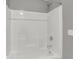 Clean bathtub and shower combination with bright white surround and modern fixtures at 6675 Halsey St, Zionsville, IN 46077