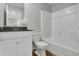 Clean bathroom features a white vanity with dark countertop, toilet, and a shower-tub combination at 6675 Halsey St, Zionsville, IN 46077