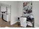 Contemporary home office featuring a dark desk, globe, and abstract art piece at 6675 Halsey St, Zionsville, IN 46077
