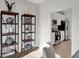 Stylish shelves displaying decor leading into a kitchen with stainless steel appliances at 6675 Halsey St, Zionsville, IN 46077