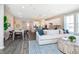 Bright open concept living room with view of kitchen and dining area at 7595 Bluegill Dr, Noblesville, IN 46062
