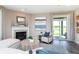 Cozy living room with fireplace and sliding glass doors to the backyard at 7595 Bluegill Dr, Noblesville, IN 46062