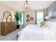 Bright bedroom with large windows, textured wall, and comfortable decor at 7595 Bluegill Dr, Noblesville, IN 46062