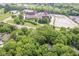 Overhead view of house and church nearby surrounded by trees and greenery at 7775 N Meridian St, Indianapolis, IN 46260