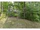View of wooded backyard, showcasing mature trees and natural surroundings at 7775 N Meridian St, Indianapolis, IN 46260