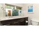 Bathroom featuring modern vanity with sleek fixtures, spacious countertop, and a glass enclosed shower at 7775 N Meridian St, Indianapolis, IN 46260