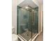 Modern bathroom featuring a stylish glass enclosed shower with sleek tile and modern fixtures at 7775 N Meridian St, Indianapolis, IN 46260