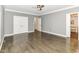 Large bedroom with hardwood floors, double closets, and ensuite bathroom at 7775 N Meridian St, Indianapolis, IN 46260