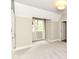 Bright bedroom featuring neutral carpet, and natural light from a charming window at 7775 N Meridian St, Indianapolis, IN 46260