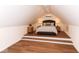 A unique bedroom featuring a raised platform, recessed lighting, and neutral decor at 7775 N Meridian St, Indianapolis, IN 46260