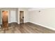 Bedroom featuring hardwood floors, neutral walls and multiple entryways at 7775 N Meridian St, Indianapolis, IN 46260