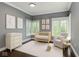 A cozy Bedroom with a light wood crib, changing table, and comfy chair at 7775 N Meridian St, Indianapolis, IN 46260