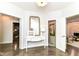 Entryway featuring a console table, a mirror, and access to multiple rooms at 7775 N Meridian St, Indianapolis, IN 46260