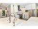 Modern kitchen features white cabinets, marble countertops, stainless steel appliances, and designer backsplash at 7775 N Meridian St, Indianapolis, IN 46260