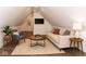 A bright living room with a TV, comfortable seating, and modern decor at 7775 N Meridian St, Indianapolis, IN 46260