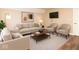 An inviting living room is furnished with neutral sofas and a modern coffee table at 7775 N Meridian St, Indianapolis, IN 46260