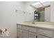 Bathroom features a white vanity with a shower in the mirror's reflection at 813 Boulder Rd, Indianapolis, IN 46217