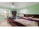 Spacious bedroom featuring two comfortable beds, natural light, and a doorway into the bathroom at 813 Boulder Rd, Indianapolis, IN 46217