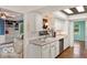 Kitchen with white cabinets and countertops showing modern appliances at 813 Boulder Rd, Indianapolis, IN 46217