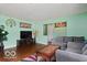 Comfortable living room boasts hardwood floors, calming paint, and a cozy seating arrangement for relaxing at 813 Boulder Rd, Indianapolis, IN 46217