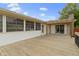 A spacious wooden back porch featuring a covered area and sliding door access to the home's interior at 823 W 200 N, Greenfield, IN 46140