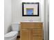 Bright bathroom featuring a wood vanity, framed mirror, and modern fixtures at 823 W 200 N, Greenfield, IN 46140