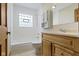 Bright bathroom with a tub and shower combination and a natural wood vanity at 823 W 200 N, Greenfield, IN 46140