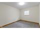 Smaller bedroom with a window, neutral walls and a wall heater at 823 W 200 N, Greenfield, IN 46140