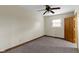 Neutral bedroom with ceiling fan, light-colored walls, carpet and one window at 823 W 200 N, Greenfield, IN 46140
