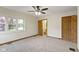 Bedroom with neutral walls, gray carpet, and several large windows at 823 W 200 N, Greenfield, IN 46140