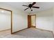 Light bedroom featuring ceiling fan, neutral walls, carpet and two doorways at 823 W 200 N, Greenfield, IN 46140
